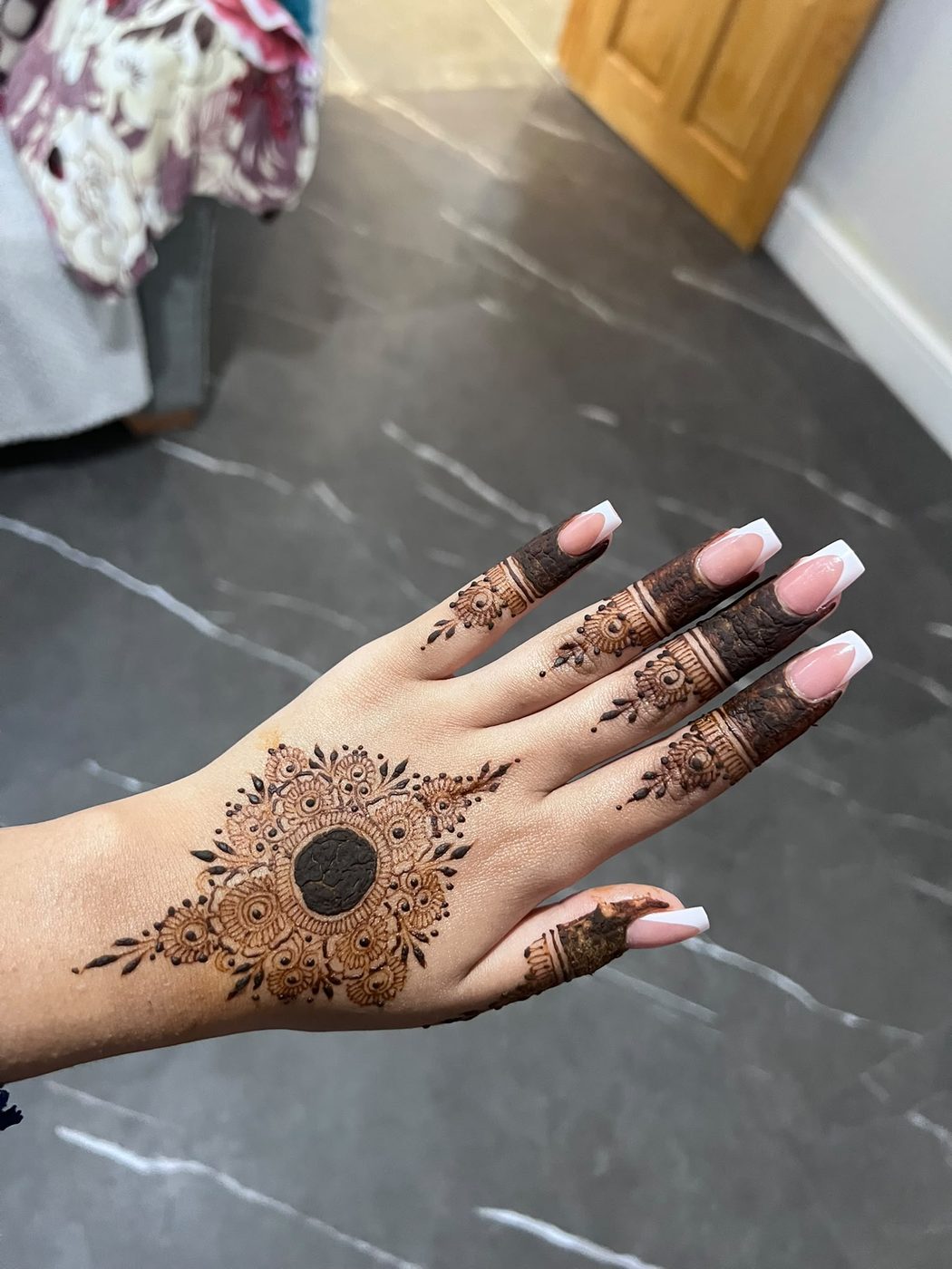 Elegant henna design on hand by HennaByEish